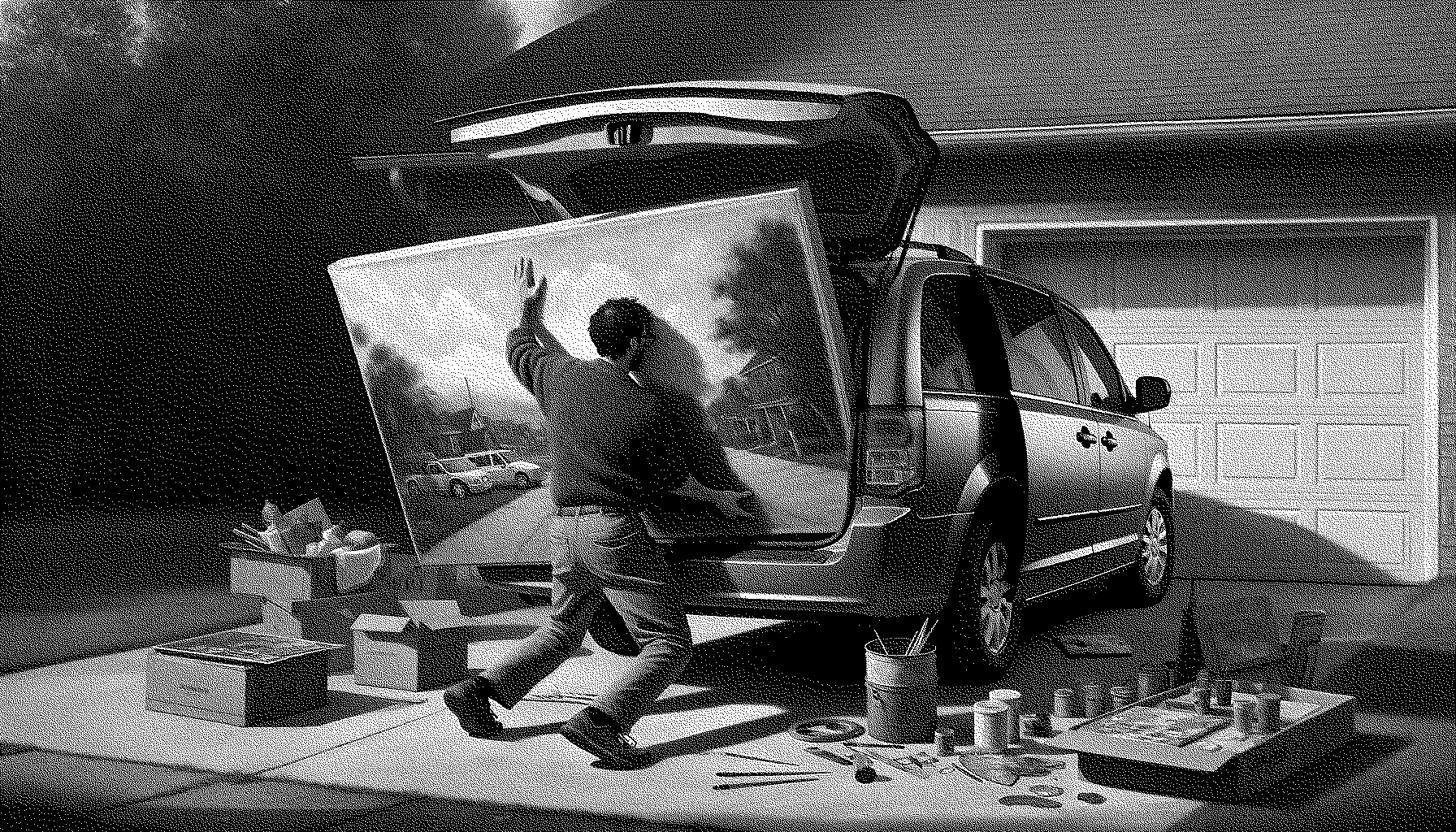 Artist trying to get a painiting into a minivan that is too small for the painting they are trying to get into it.